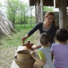 Working hands around the set table- from the seed to bread